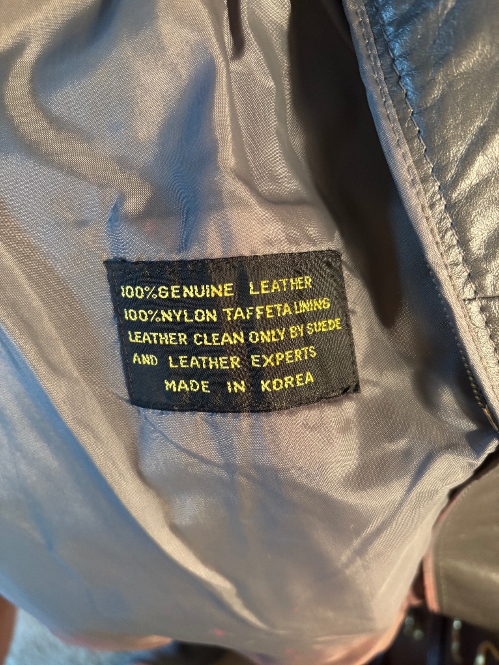 woman's vintage grey leather coat